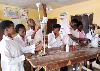 student performing experiment